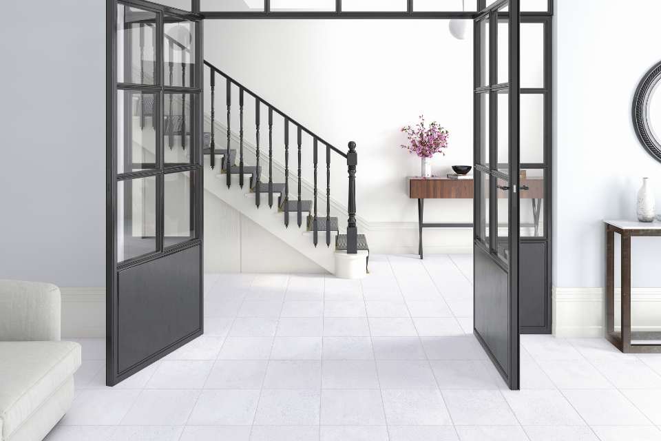 monochromatic white entryway with white tiles and black accents